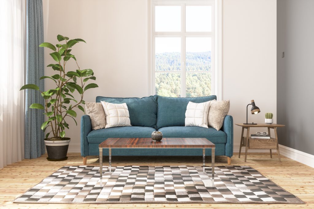 Living room with a couch that has sleek arm rest.